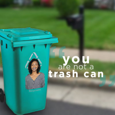 Trash Can on the side of the street with Khadijahs face on it